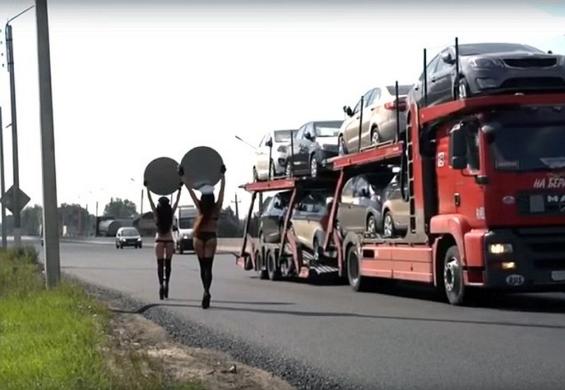 Topless Women Carry Speed Limit Signs For Road Safety Campaign in Russia 